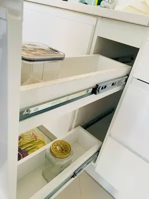 a white refrigerator with its door open at SuAparts in Praia