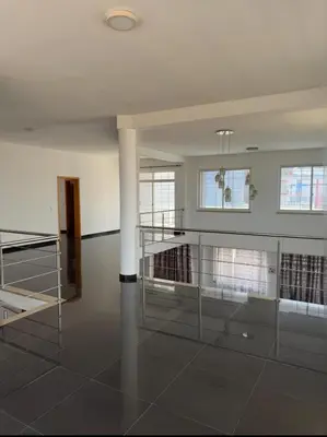 an empty room with a glass floor and windows at Villa RESIDENCIAL EUNICE in Praia
