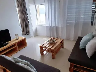 a living room with a couch and a coffee table at L2B - São Vicente in Mindelo