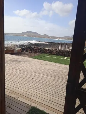 a view of the ocean from the porch of a house at L2B - São Vicente in Mindelo