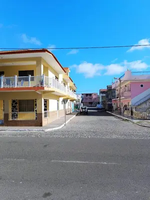 an empty street in a town with buildings at Pensão Dona Fica in Tarrafal