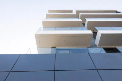 a row of tables and benches in a building at Lux 3-BR: Panoramic Sea View & Rooftop Pool in Praia