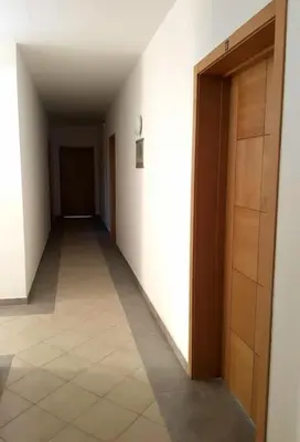 an empty hallway with a door and a tile floor at Ideal Location in Sal Rei