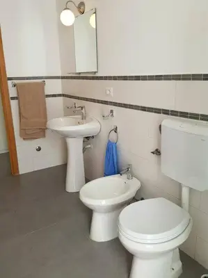 a bathroom with a toilet and a sink at Ideal Location in Sal Rei