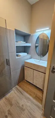 a bathroom with a sink and a mirror at Flat City Center Mindelo in Mindelo