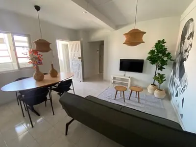 a living room with a couch and a table at MorabezaHome- Apartment Tati in Mindelo