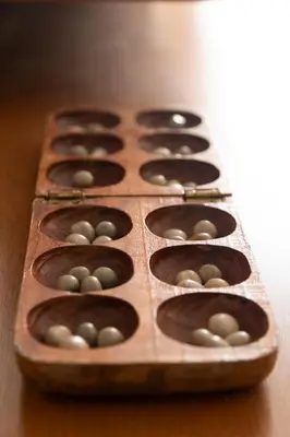 a wooden box of chocolate donuts sitting on a table at 2 bdr apt in Palmarejo Baixo, near seafront - LCGR in Praia
