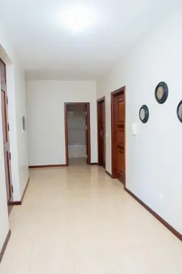 an empty room with two doors and a white floor at JT Sea View Apartment T3 in Praia