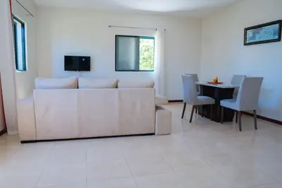a living room with a couch and a table at JT Sea View Apartment T3 in Praia