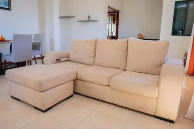 a white couch sitting in a living room at JT Sea View Apartment T3 in Praia
