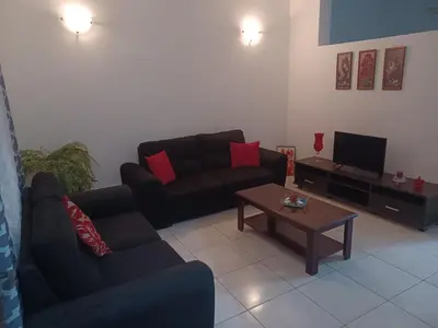 a living room with a couch and a coffee table at Repousando II in Ribeira Grande