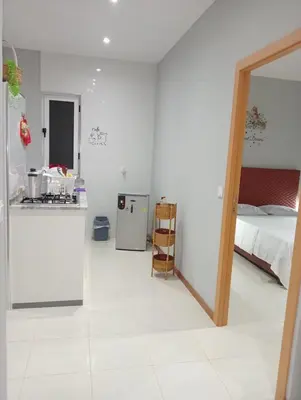 a white room with a kitchen and a bed at Niclas ApartamentoT1 in Praia