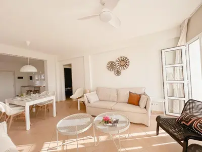 a living room with a couch and a table at Papaya Apartments Boa Vista in Sal Rei