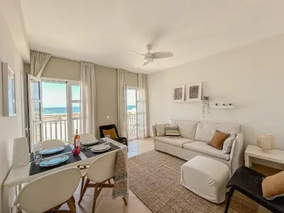 a living room with a couch and a table at Papaya Apartments Boa Vista in Sal Rei