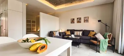 a living room with a white table and a couch at Papaya Apartments Sal Island in Santa Maria