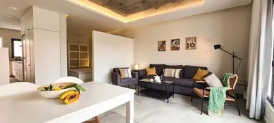 a living room with a couch and a table at Papaya Apartments Sal Island in Santa Maria