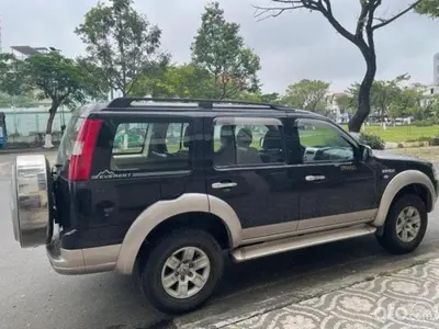 a black and silver suv parked on a street at Apto Martins - Prédio Residencial Inês nº23 in Vila do Maio