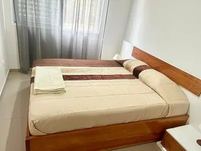 a small bedroom with a bed in a room at Apartamento Da Costa in Mão para Trás