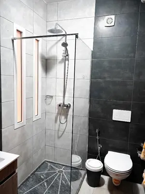 a bathroom with a shower and a toilet at P&SApartments in Santa Maria