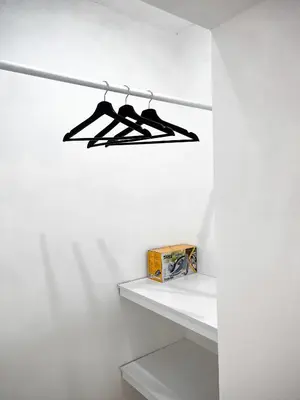a shelf in a white room with a box on it at P&SApartments in Santa Maria