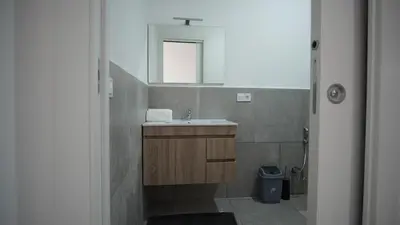 a bathroom with a sink and a mirror at Atlantico Sal Apt in Santa Maria