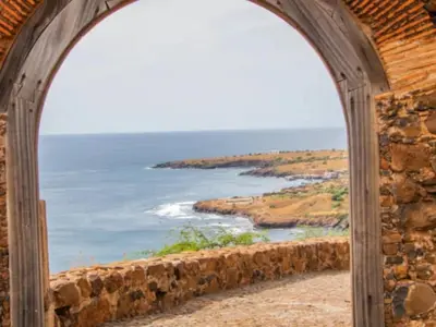 an archway with a view of the ocean at Get house kira in Cidade Velha