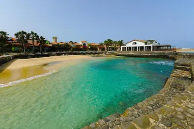 an aerial view of a beach with a house at T1 Vista Mar - Porto Antigo 3 in Santa Maria