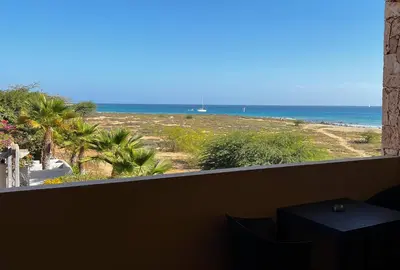 a view of the beach from a balcony at T1 Vista Mar - Porto Antigo 3 in Santa Maria