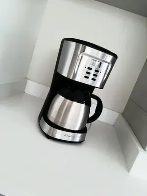 a black and silver coffee maker sitting on a counter at Morabeza Deluxe view on the sea in Mindelo