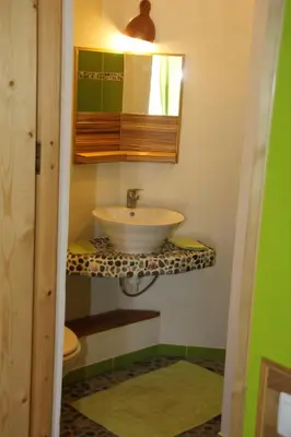 a bathroom with a sink and a mirror at Casa De France in Porto Novo