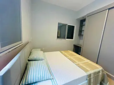 a small white room with a bed and a window at Aparthotel Pilon T3 in Praia