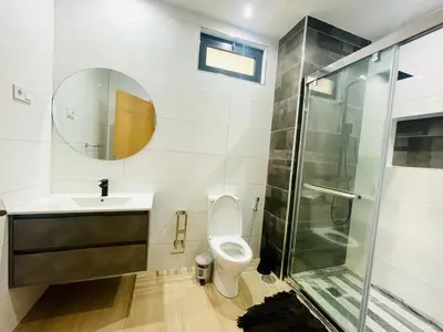 a bathroom with a toilet and a sink and a shower at Aparthotel DI LIA T3 in Praia