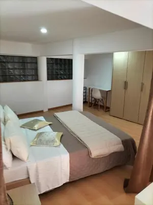 a bedroom with a large bed in a room at mezzanino Ribeira Brava in Vila da Ribeira Brava