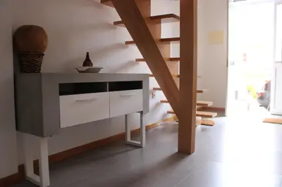 a staircase in a room with a desk and stairs at mezzanino Ribeira Brava in Vila da Ribeira Brava