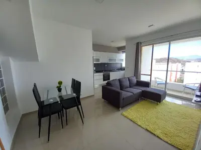 a living room with a couch and a table at SILVAs Apartment in Mindelo
