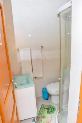a small bathroom with a toilet and a shower at Hot belvedere in Praia