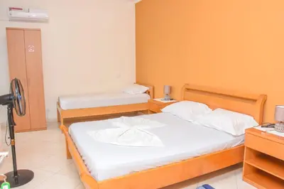 a bedroom with two beds and a camera at Hot belvedere in Praia