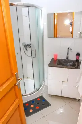 a bathroom with a shower and a sink at Hot belvedere in Praia
