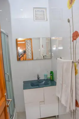 a bathroom with a sink and a mirror at Hot belvedere in Praia