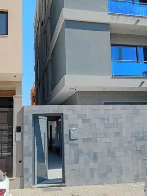 a building with a doorway in front of it at Holiday Apartments TF in Praia