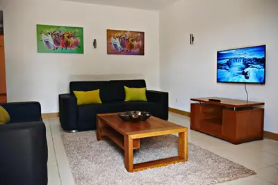 a living room with a couch and a coffee table at Mi Casa és Su Casa in Prainha