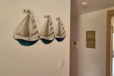 a group of three boats hanging on a wall at SUNNY Apartment - SAL VILA VERDE - Cabo Verde in Santa Maria