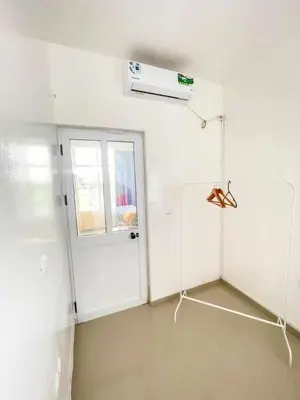 a room with a white door and a window at Zeyden Place Apt 2 in Praia