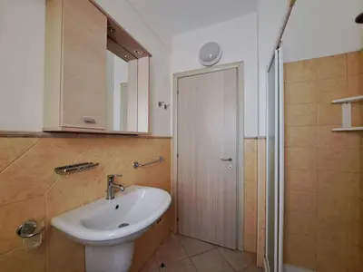 a bathroom with a sink and a shower with a mirror at Sal service coquero in Santa Maria