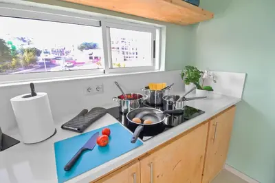 a kitchen with a counter top with pots and pans at Sea-view Central Joy! in Mindelo