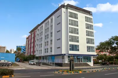 a large white building on the side of a street at Sea-view Central Joy! in Mindelo