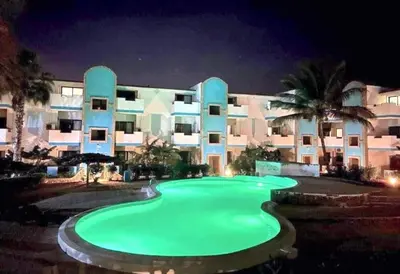 a large green pool in front of a building at Andreia in Santa Maria