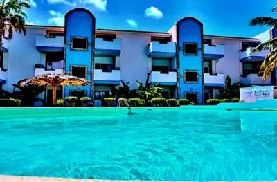 a swimming pool in front of a building at Andreia in Santa Maria
