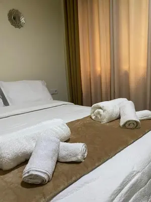 two towels on a bed in a hotel room at T1 Férias Mindelo in Mindelo