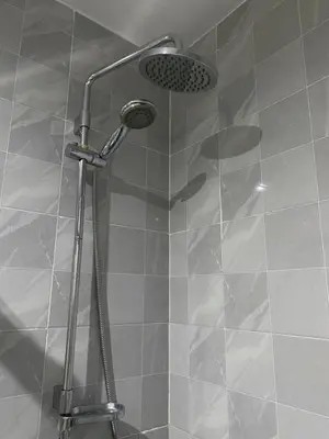 a shower with a shower head in a bathroom at T1 Férias Mindelo in Mindelo